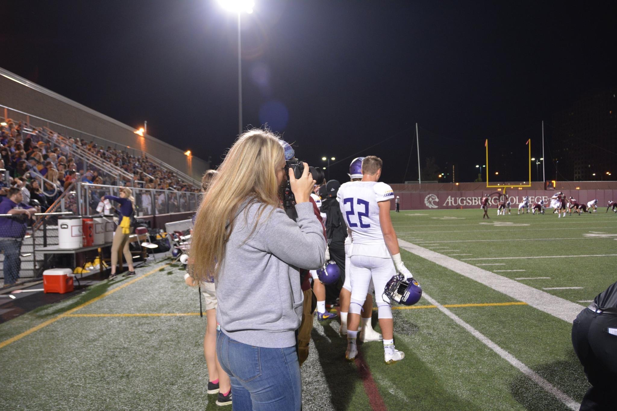 Moments by Danielle Nicole Taking Photos at UNW Football Game Day as Lead Team Photographer.