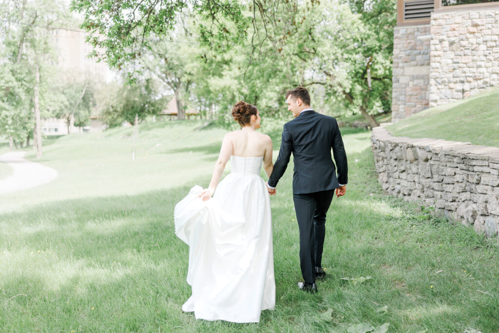 Photo of couple at preferred venue walking away from camera.