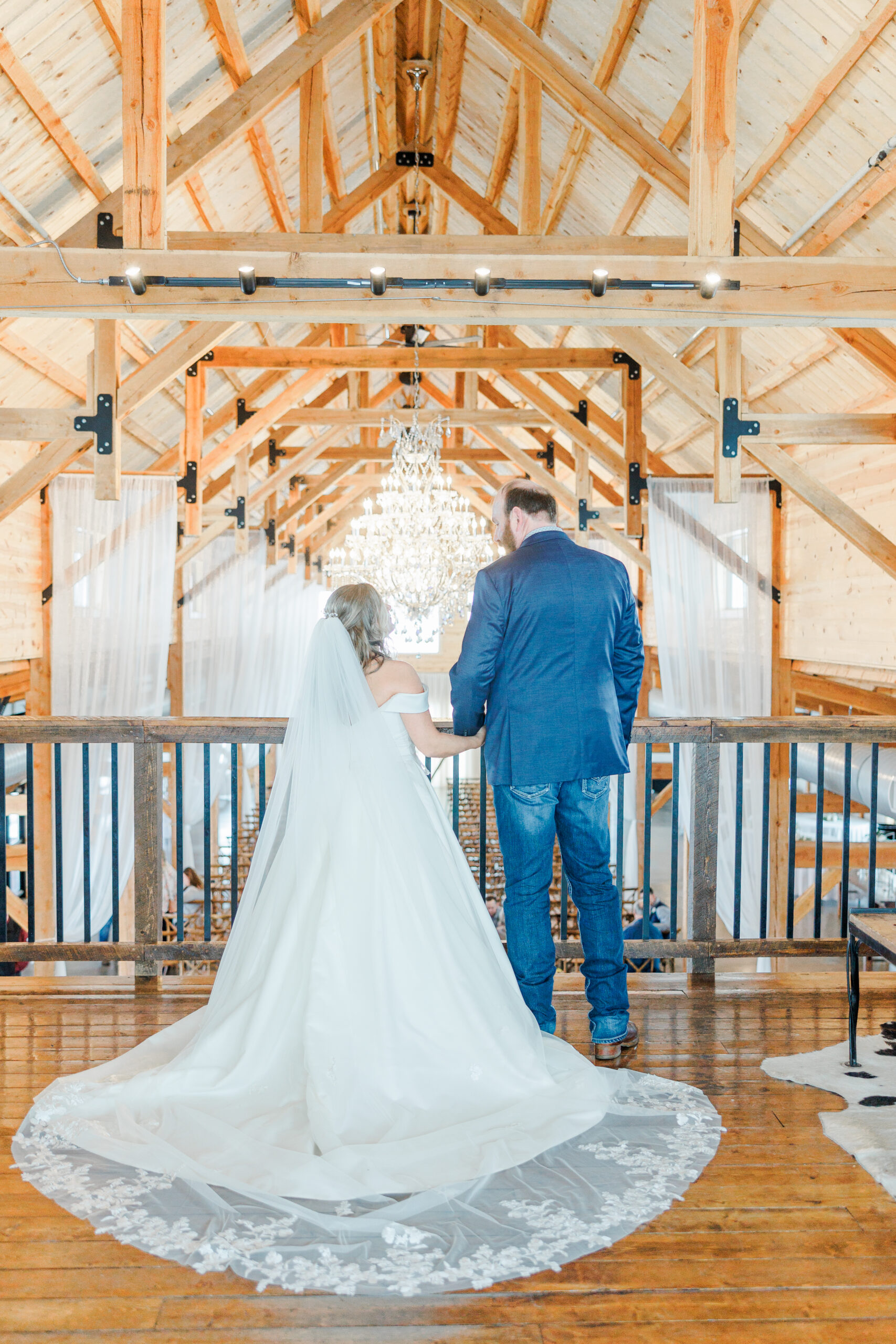 Bride and groom standing inside their The Meadow Barn at Country Orchard Wedding