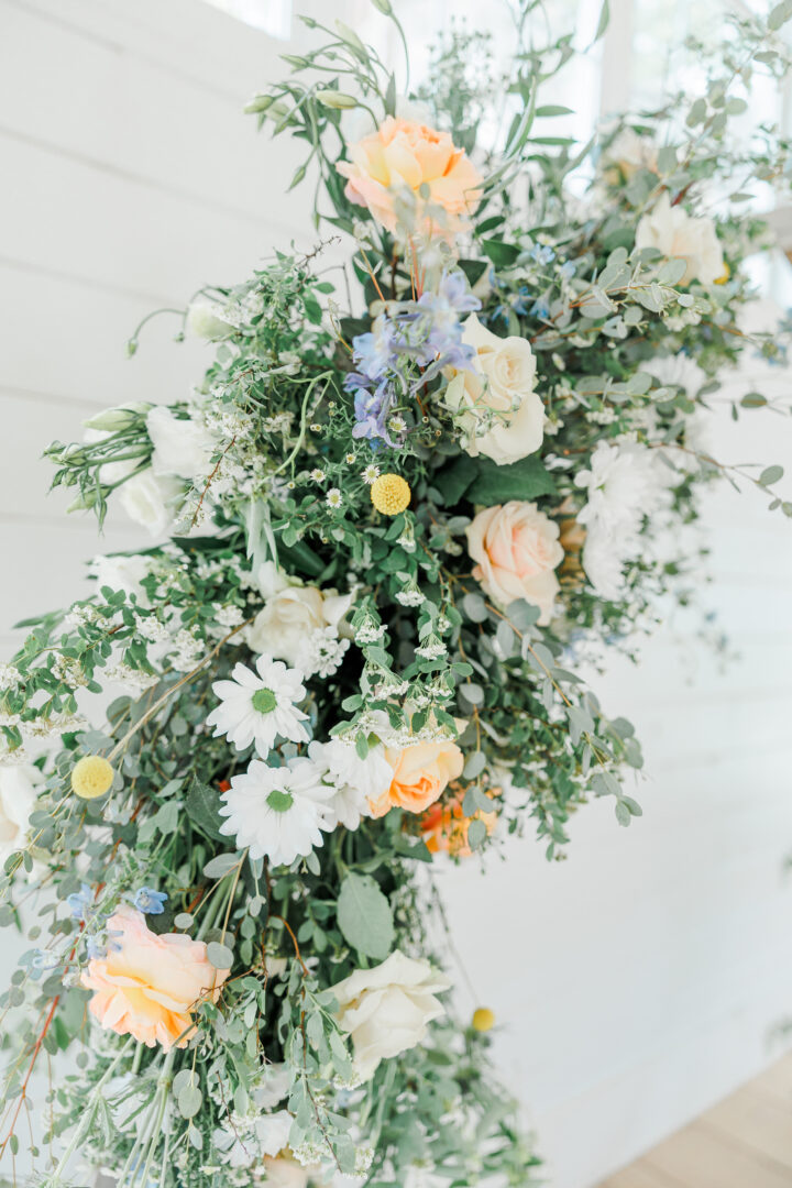 florals on alter decor at ivory north wedding ceremony barn