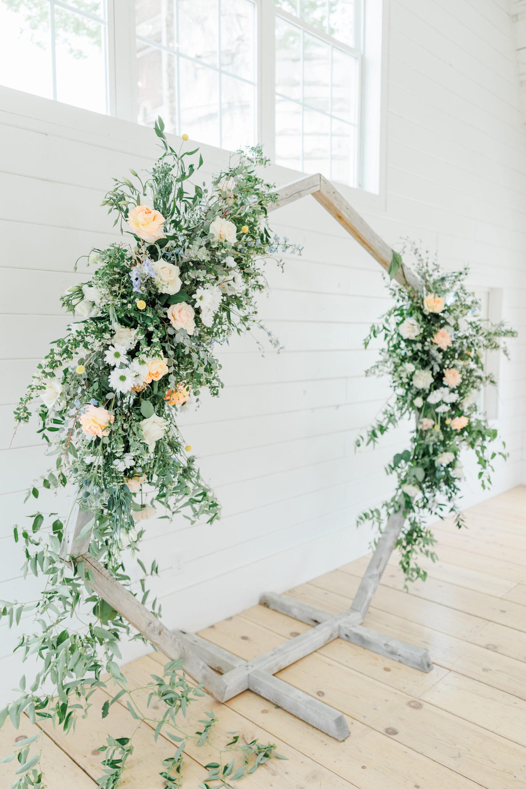 florals on alter decor at ivory north wedding ceremony barn