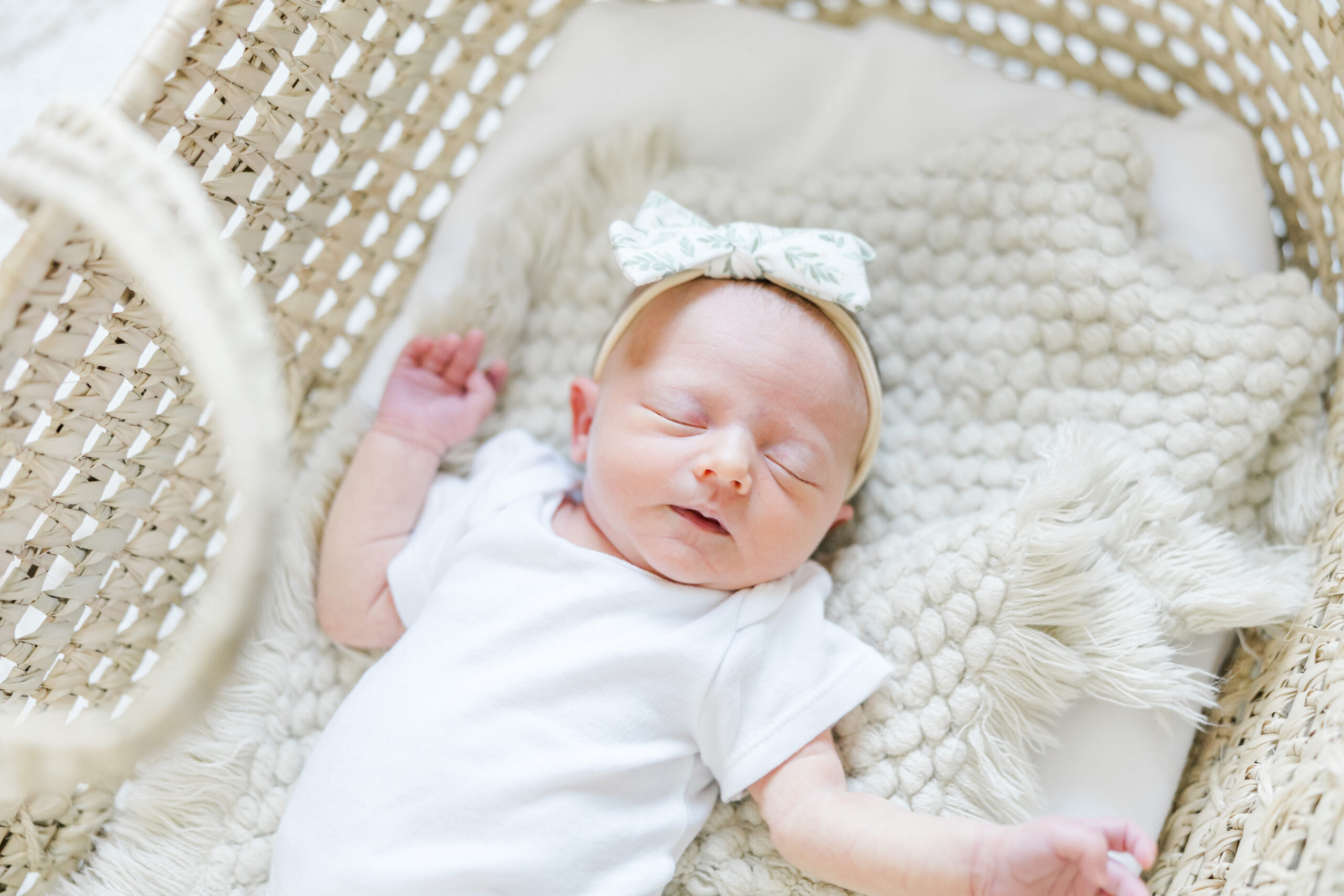 in-home newborn session photo of young couple and their newborn baby girl