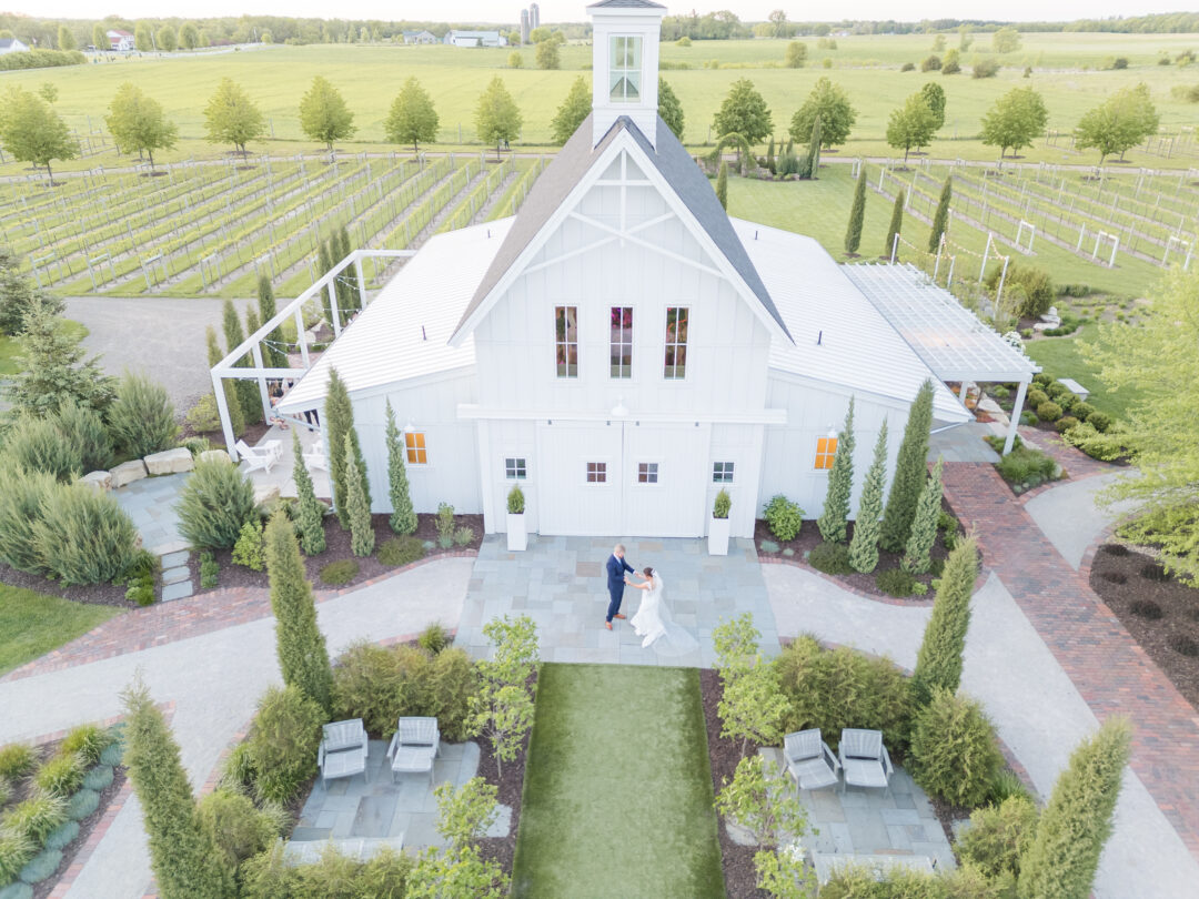 Sunset drone shot of couple's spring wedding at Redeemed Farm in Scandia, MN