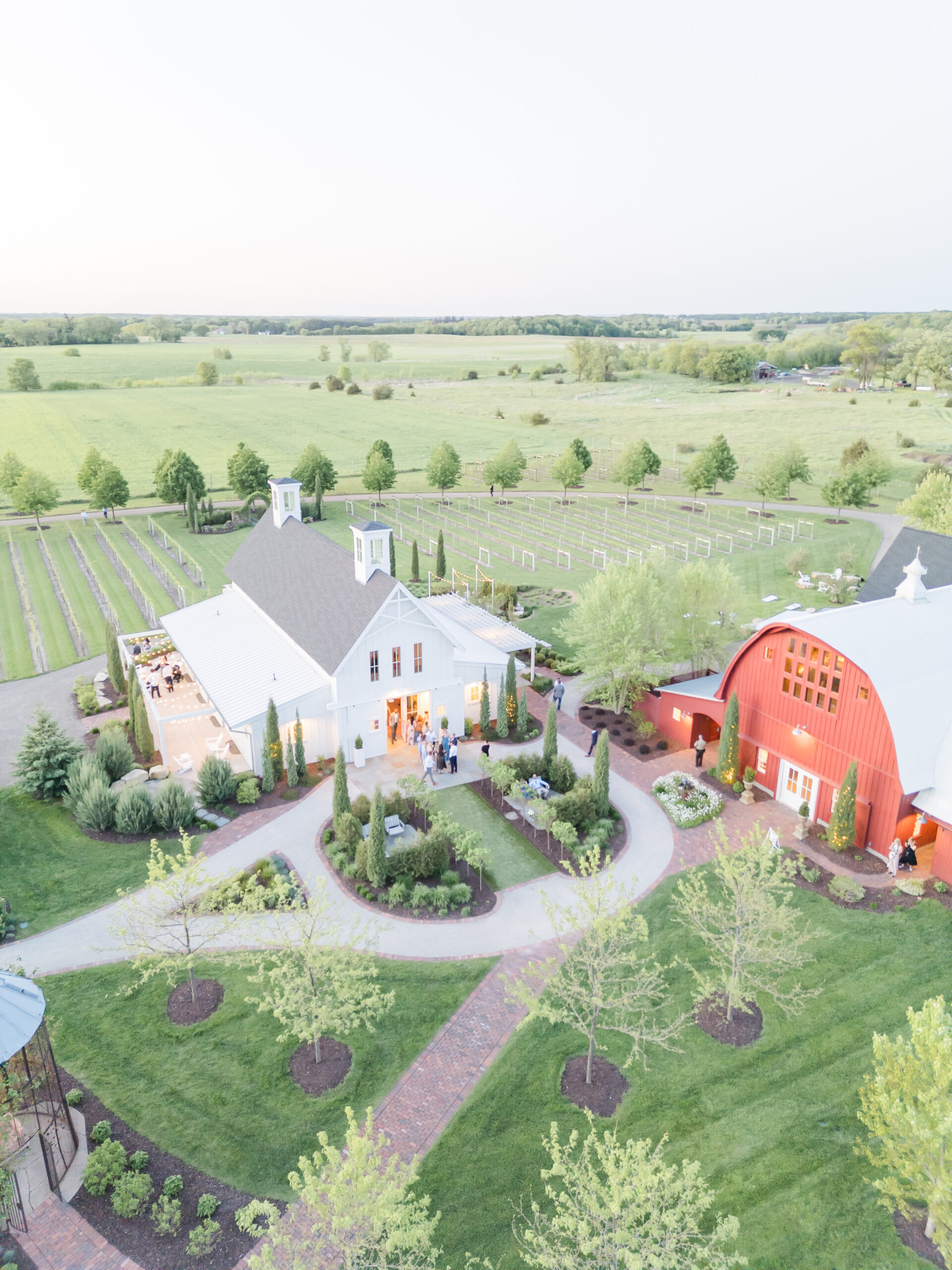 Sunset drone shot of couple's spring wedding at Redeemed Farm in Scandia, MN