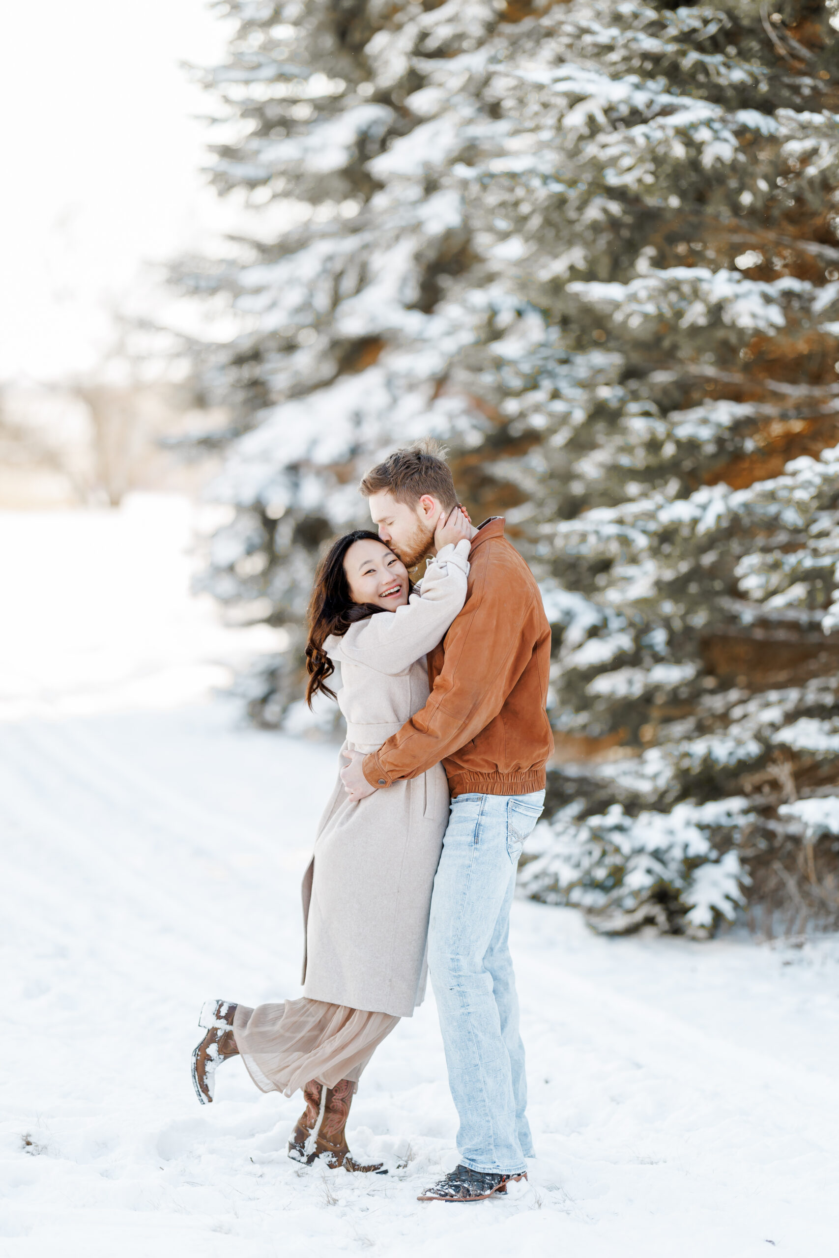 clear lake winter engagement session in the snow at moments by danielle nicole studios