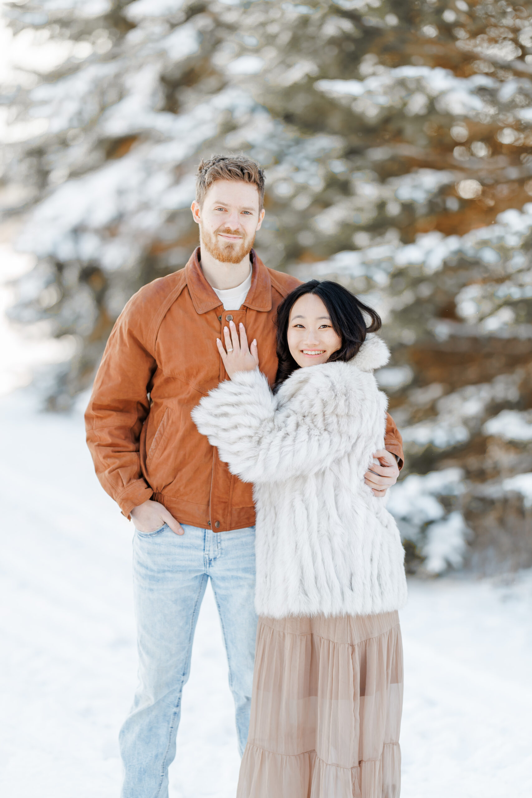 clear lake winter engagement session in the snow at moments by danielle nicole studios