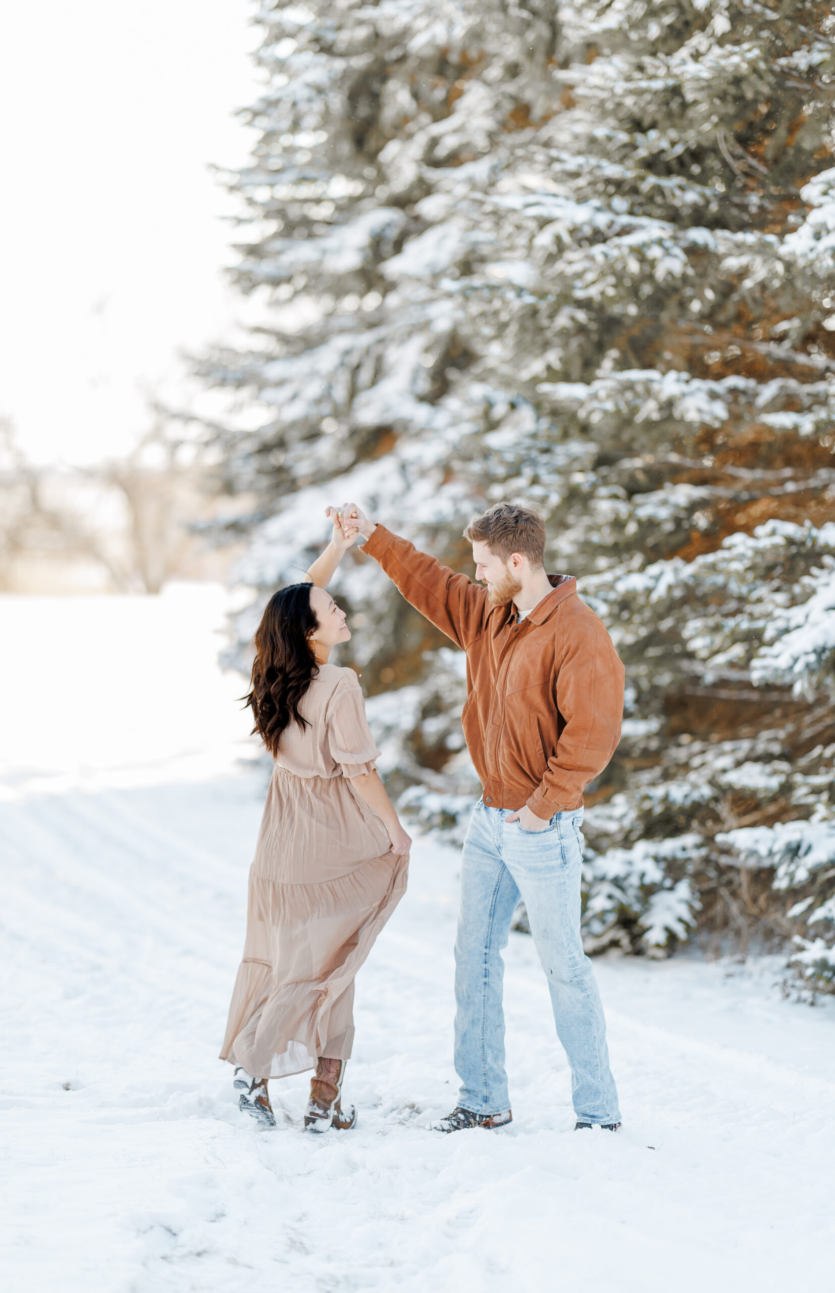 clear lake winter engagement session in the snow at moments by danielle nicole studios