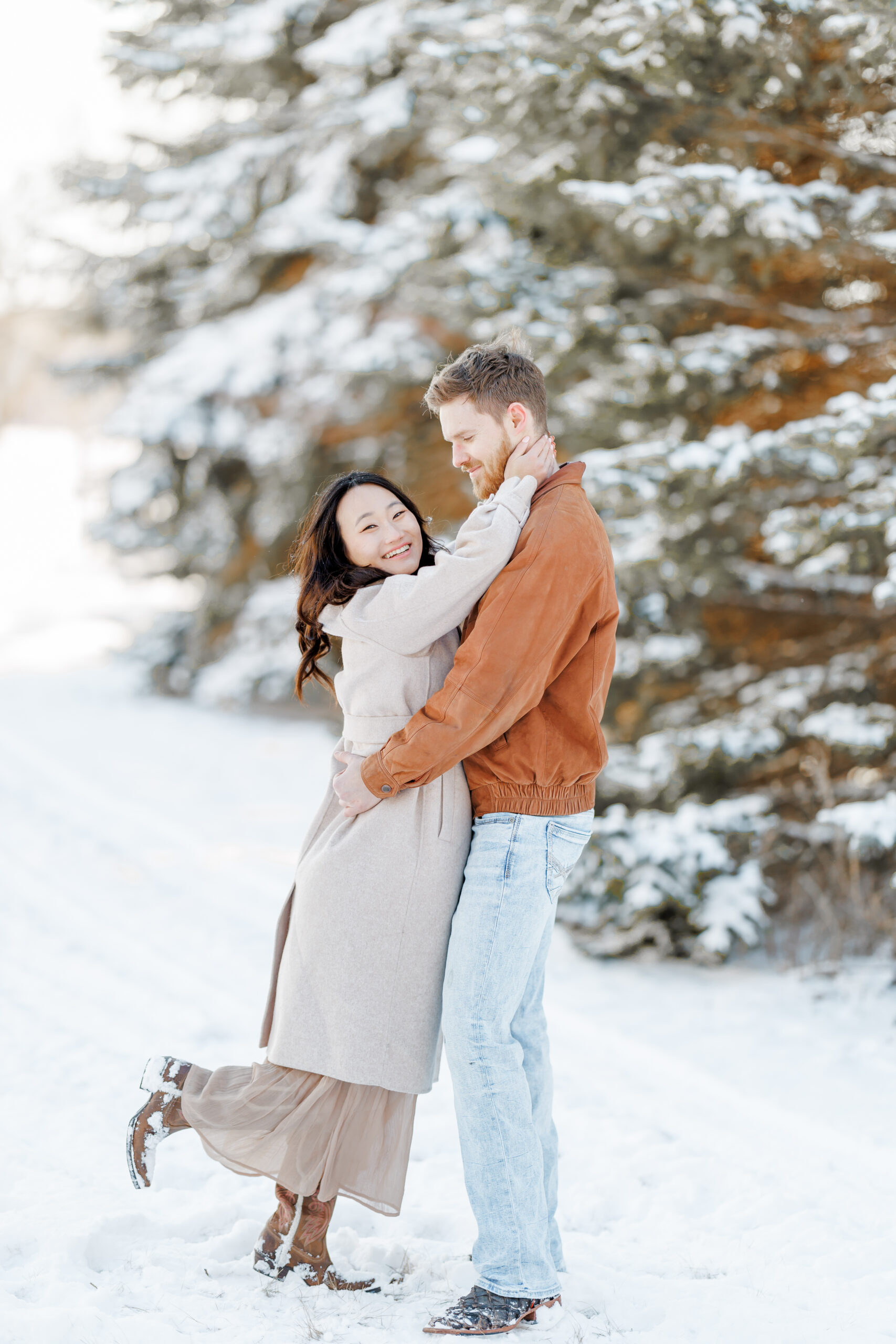 clear lake winter engagement session in the snow at moments by danielle nicole studios