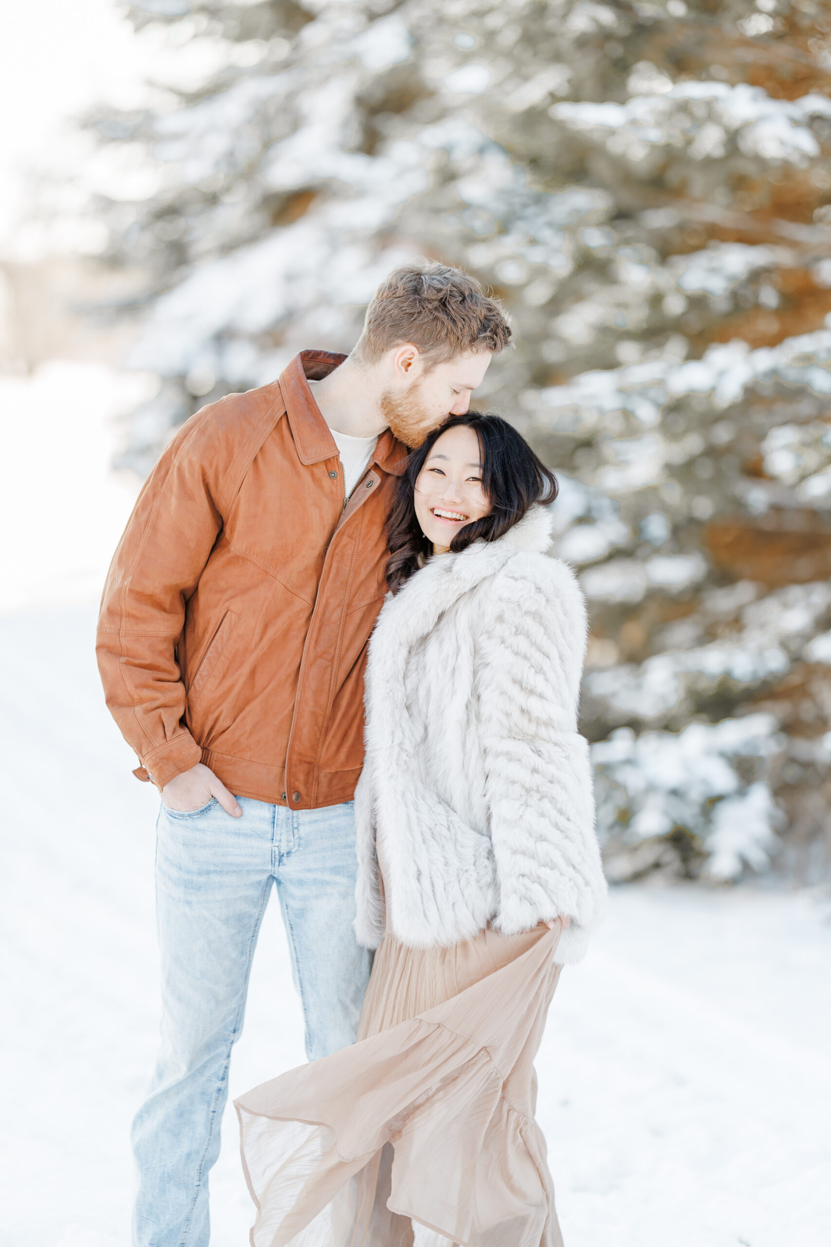 clear lake winter engagement session in the snow at moments by danielle nicole studios