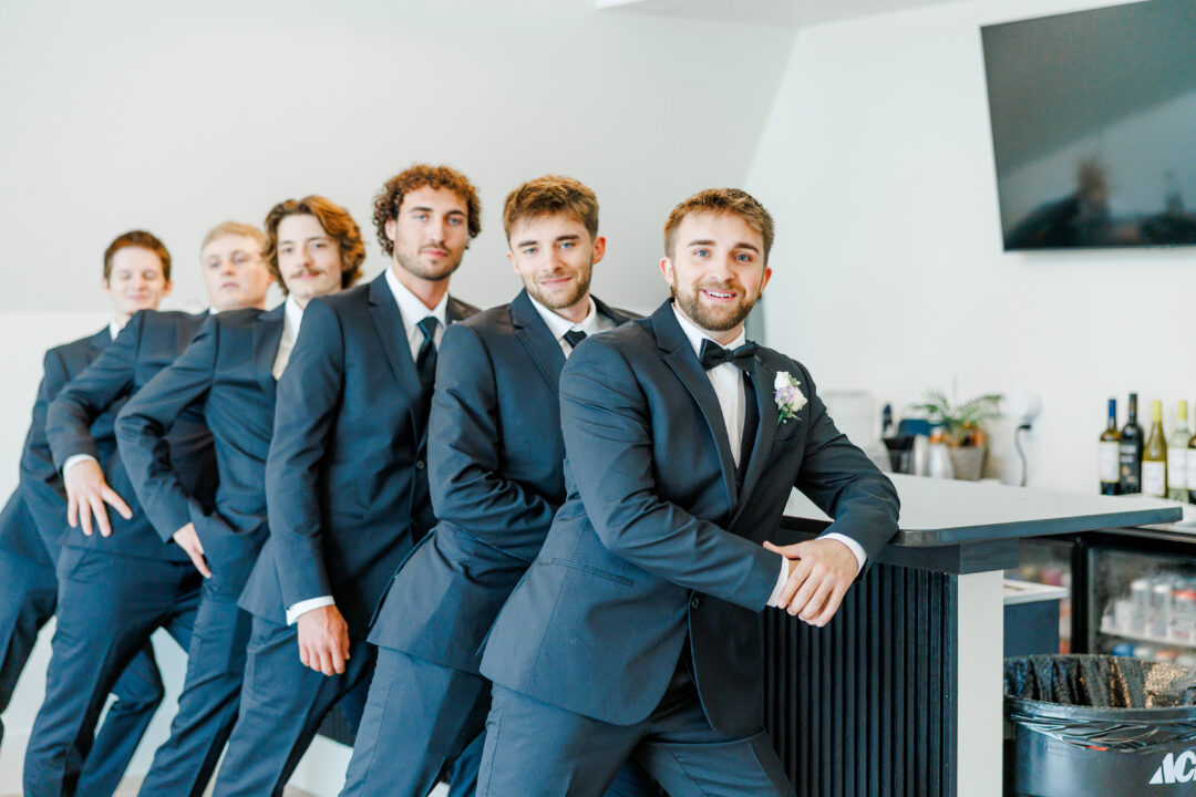 groom getting ready in A-frame airbnb at barn at aspen acres wedding