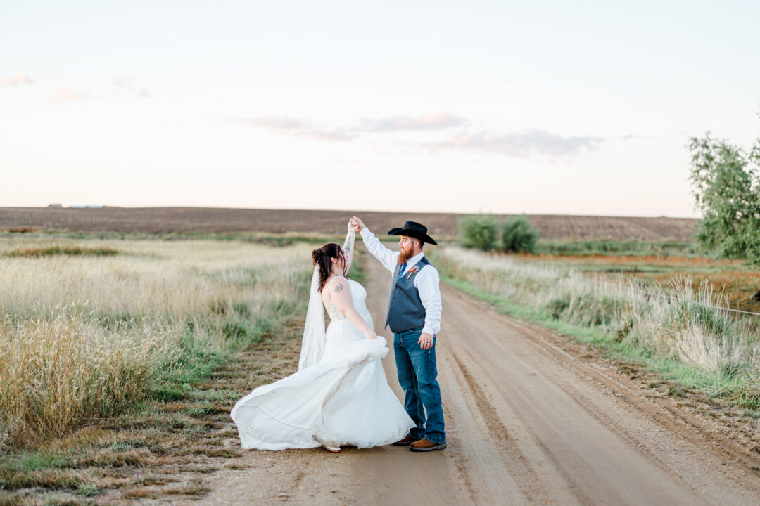 sunset photos of wedding couple at stable waters ranch